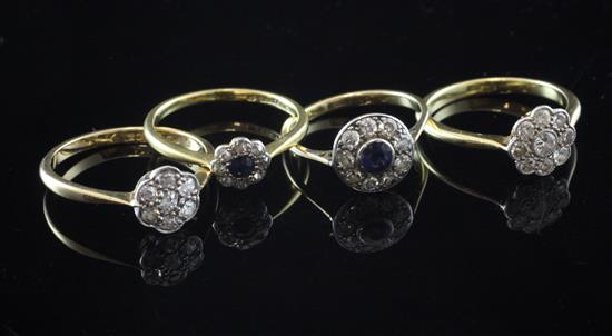 Two early 20th century 18ct gold and diamond cluster rings and two similar sapphire and diamond cluster rings, various sizes.